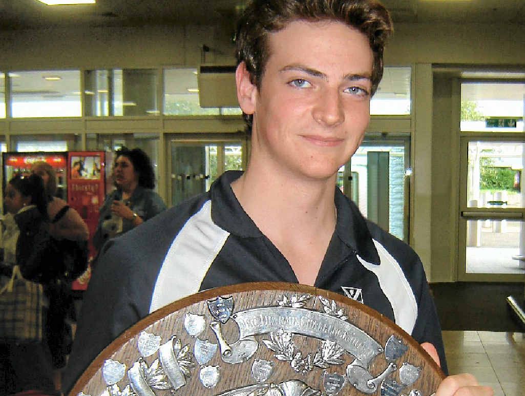 WINNERS’ SHIELD: Former Scots PGC pipe band member Kirby Douglas with the trophy after his band claimed the World Pipeband Championships. WINNERS’ SHIELD: Former Scots PGC pipe band member Kirby Douglas with the trophy after his band claimed the World Pipeband Championships.